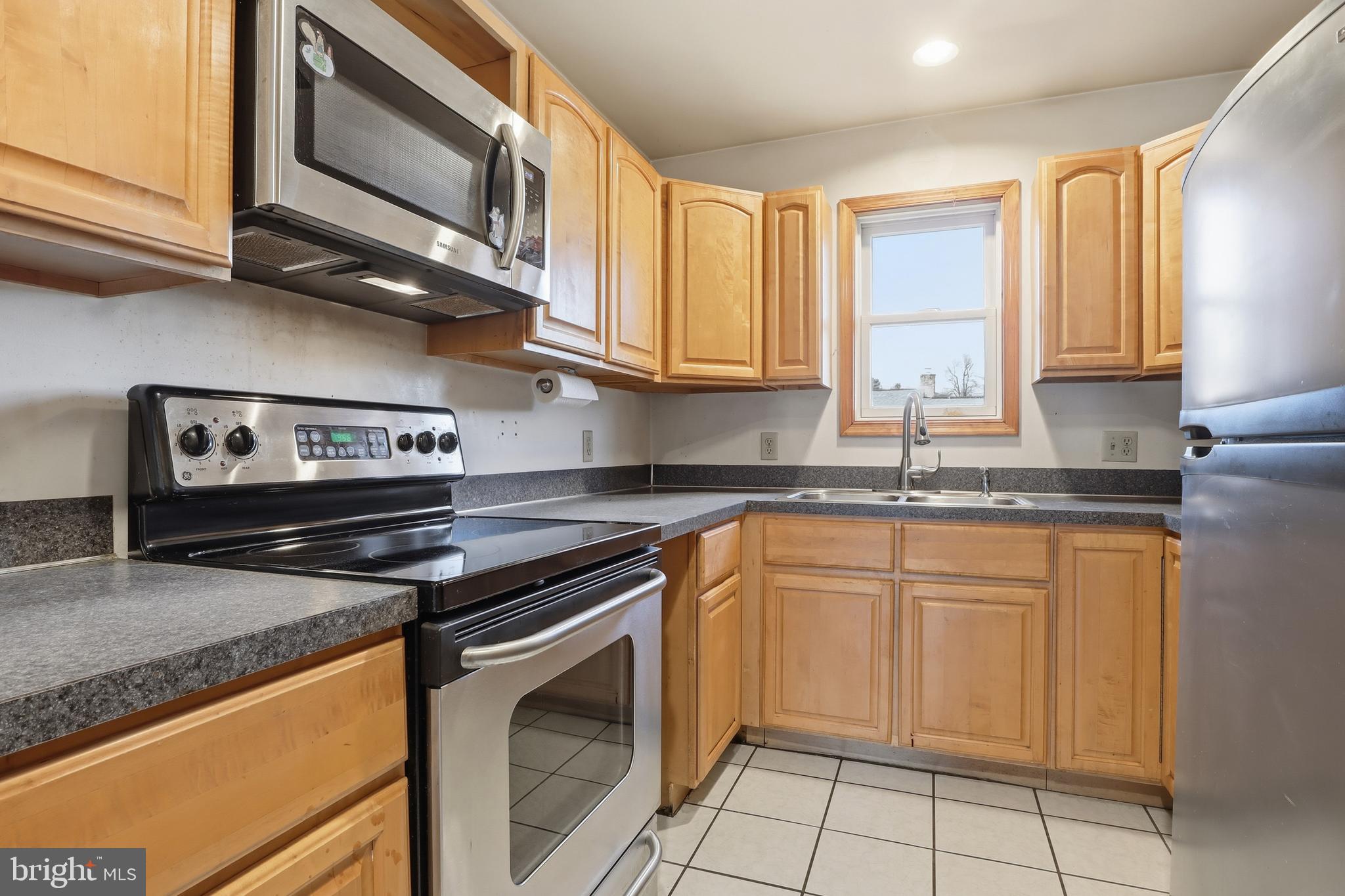 1330 Goodyear Road Gardners, PA 17324 - Photo 48 of 72 a kitchen with stainless steel appliances granite countertop a sink stove and microwave