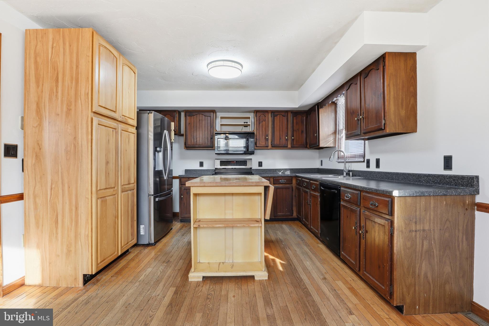 1330 Goodyear Road Gardners, PA 17324 - Photo 8 of 72 a kitchen with stainless steel appliances granite countertop a stove a sink dishwasher and a refrigerator