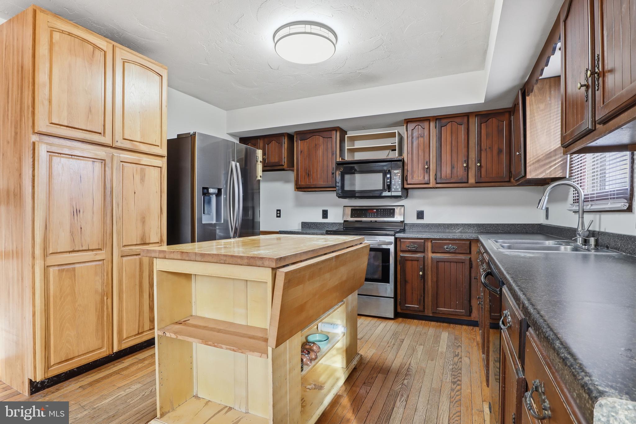 1330 Goodyear Road Gardners, PA 17324 - Photo 9 of 72 a kitchen with stainless steel appliances granite countertop a refrigerator sink and stove