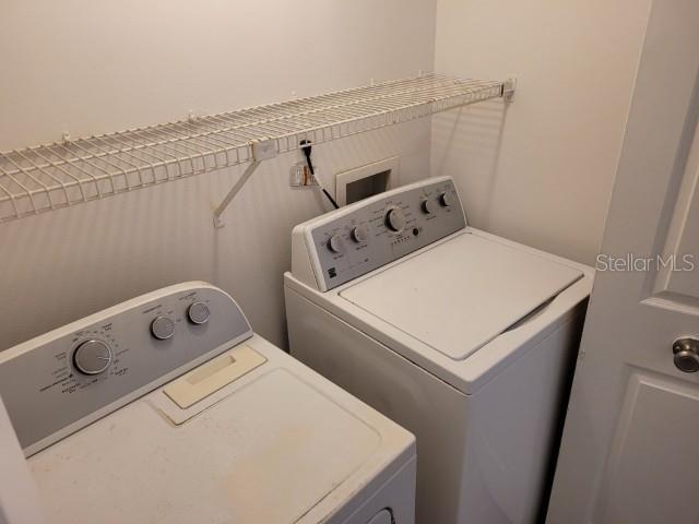 196 Riverbend Drive, Unit 102 Altamonte Springs, FL 32714 - Photo 13 of 18 a utility room with dryer and washer