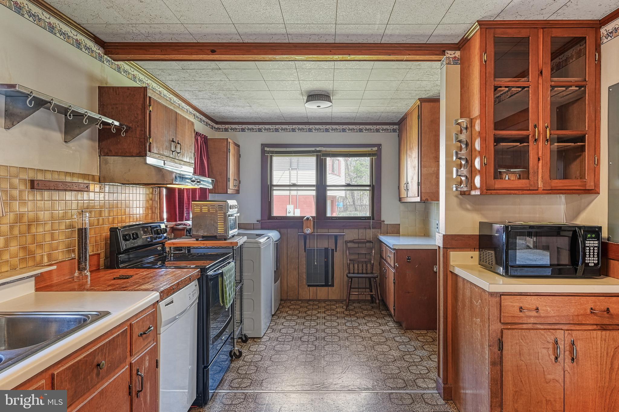 517 Doctors Road Louisa, VA 23093 - Photo 20 of 83 a kitchen with a stove sink and cabinets