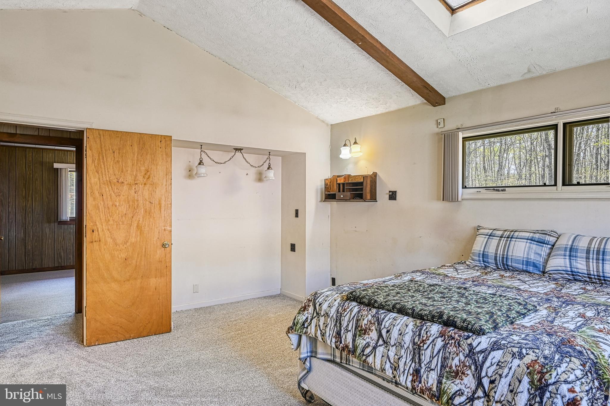 517 Doctors Road Louisa, VA 23093 - Photo 33 of 83 a bedroom with a bed and a table