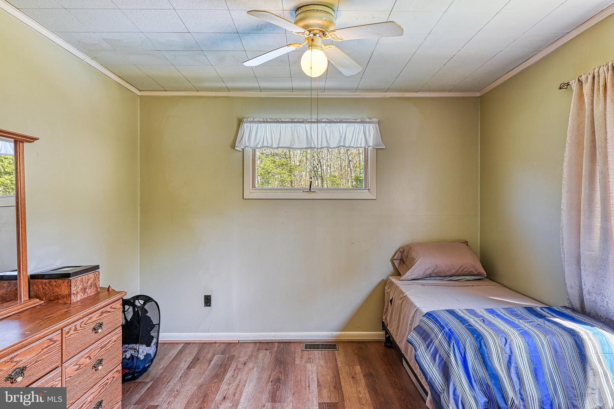 517 Doctors Road Louisa, VA 23093 - Photo 48 of 83 a bedroom with a bed and a window