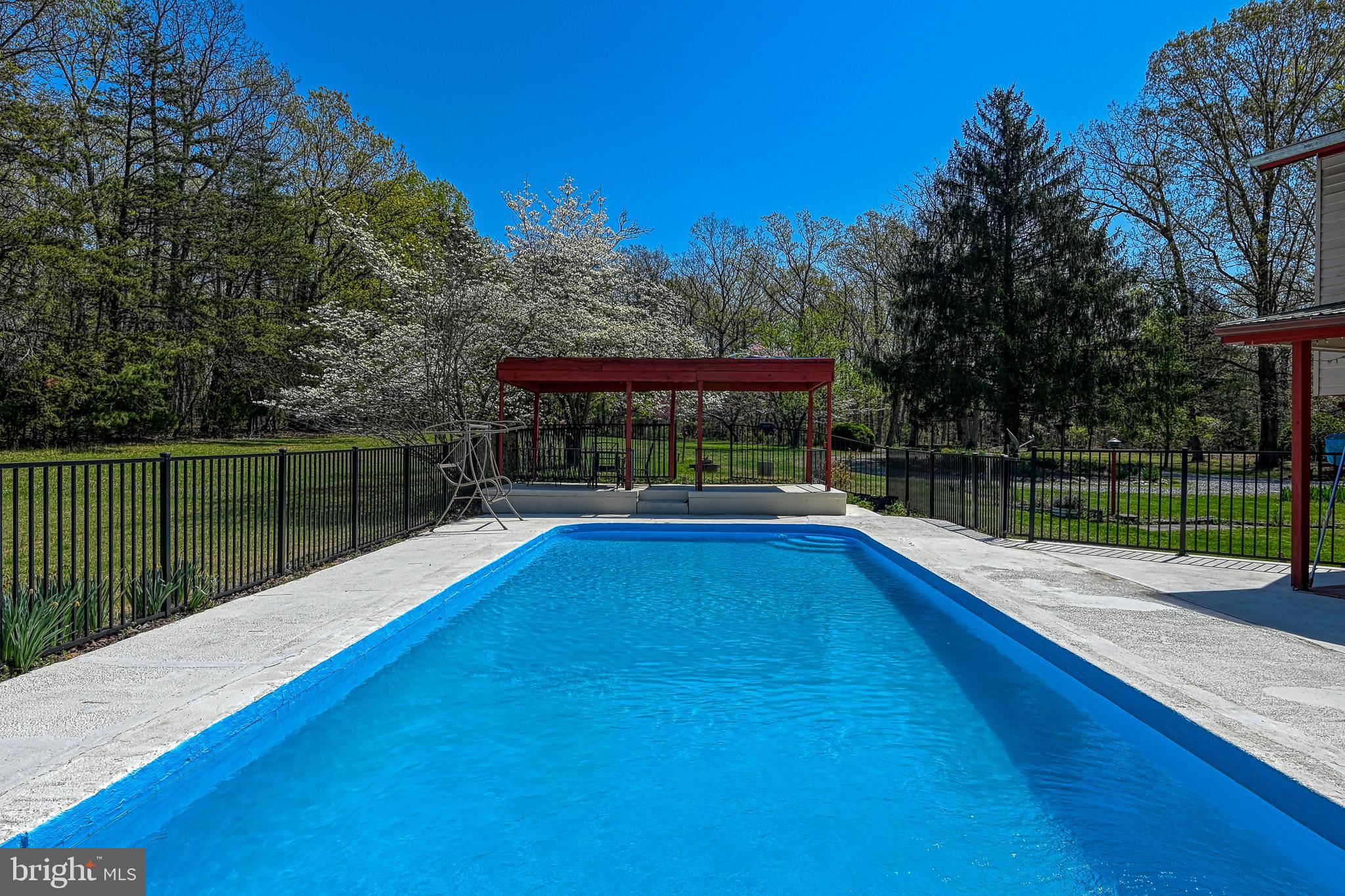 517 Doctors Road Louisa, VA 23093 - Photo 57 of 83 a view of a swimming pool with a patio