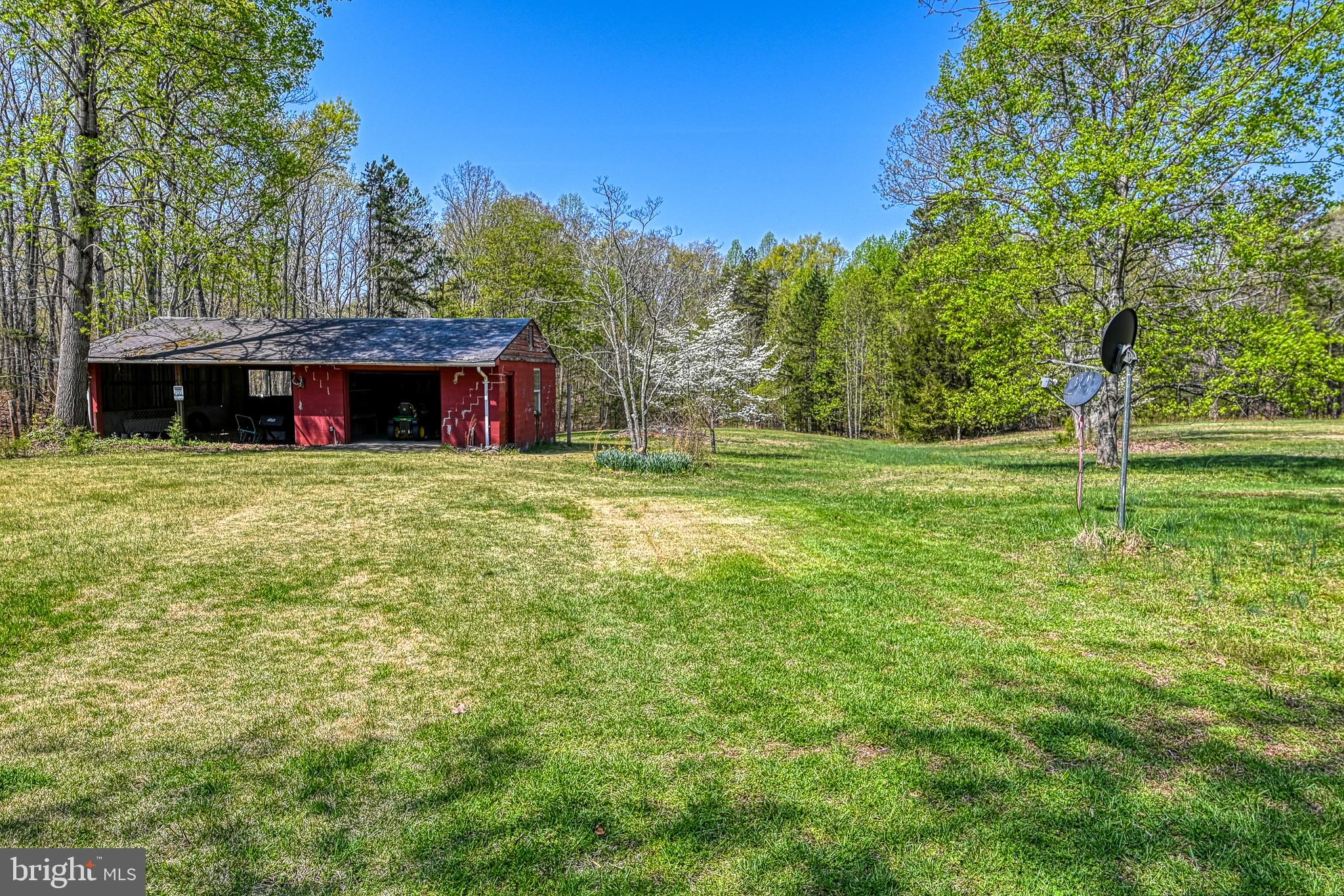 517 Doctors Road Louisa, VA 23093 - Photo 63 of 83 a view of a house with a yard and a tree