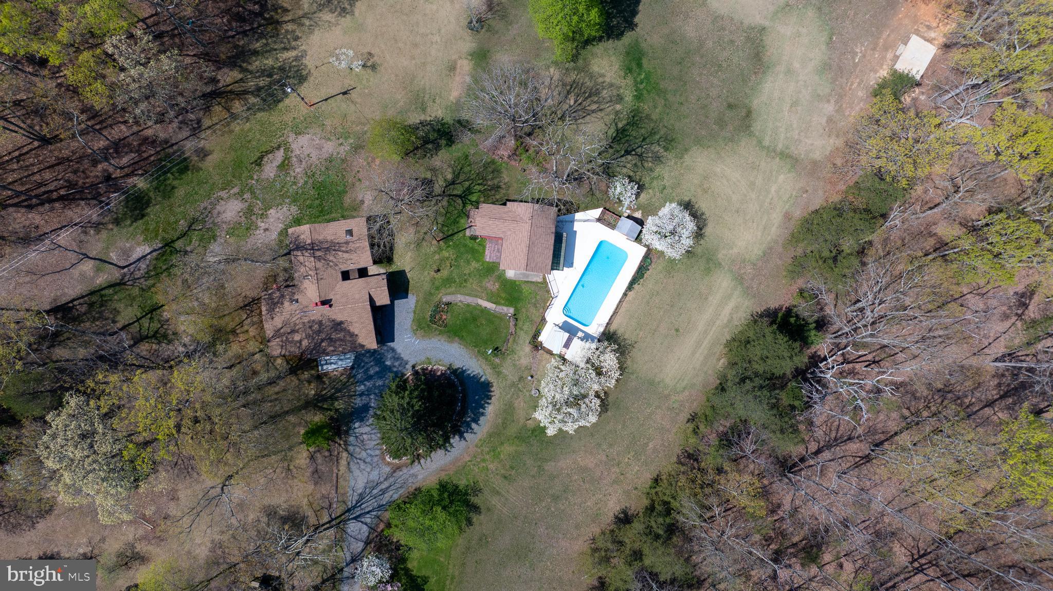 517 Doctors Road Louisa, VA 23093 - Photo 67 of 83 an aerial view of a house with a yard and trees