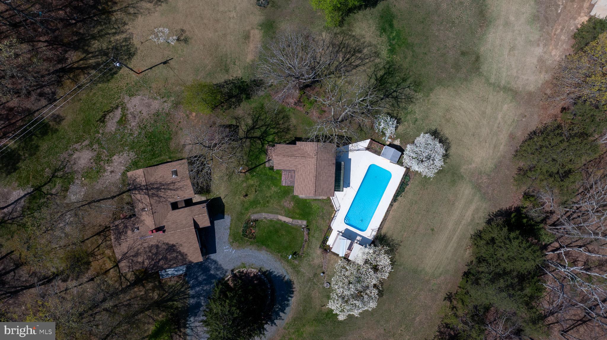 517 Doctors Road Louisa, VA 23093 - Photo 82 of 83 an aerial view of a house with a yard and trees