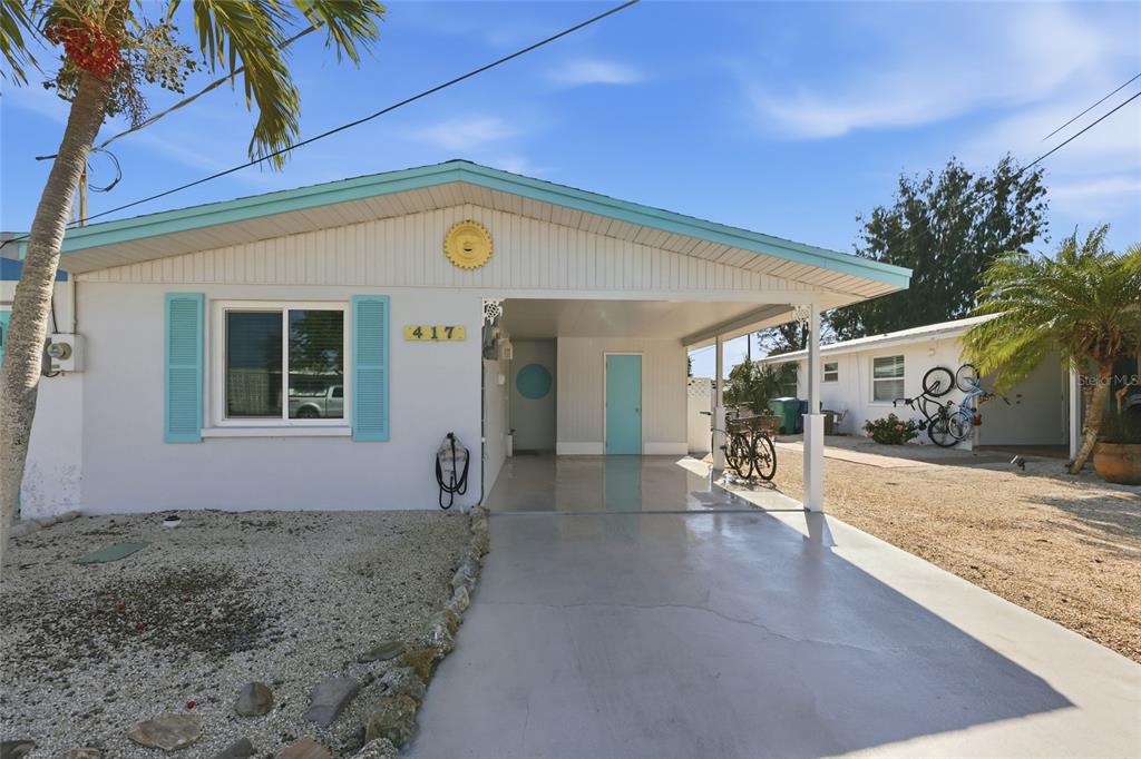 417 63rd Street Holmes Beach, FL 34217 - Photo 2 of 48 a view of a house with a patio