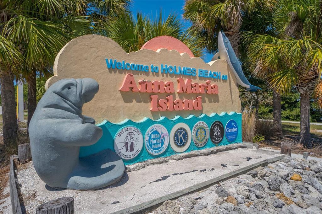 417 63rd Street Holmes Beach, FL 34217 - Photo 27 of 48 a front view of a house with garden