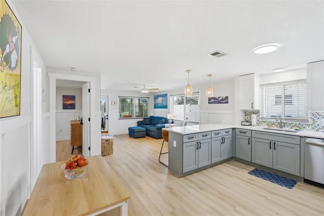 a kitchen with stainless steel appliances granite countertop a stove and cabinets