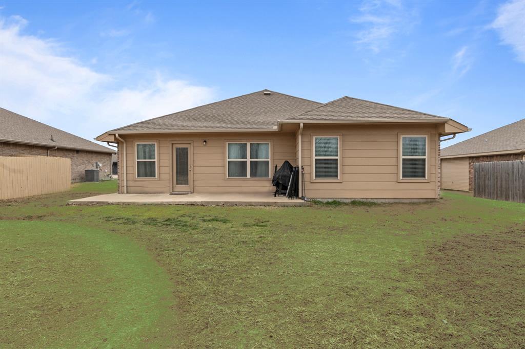 115 Oak Spgs Loop Mabank, TX 75147 - Photo 18 of 20 a view of a house with a yard