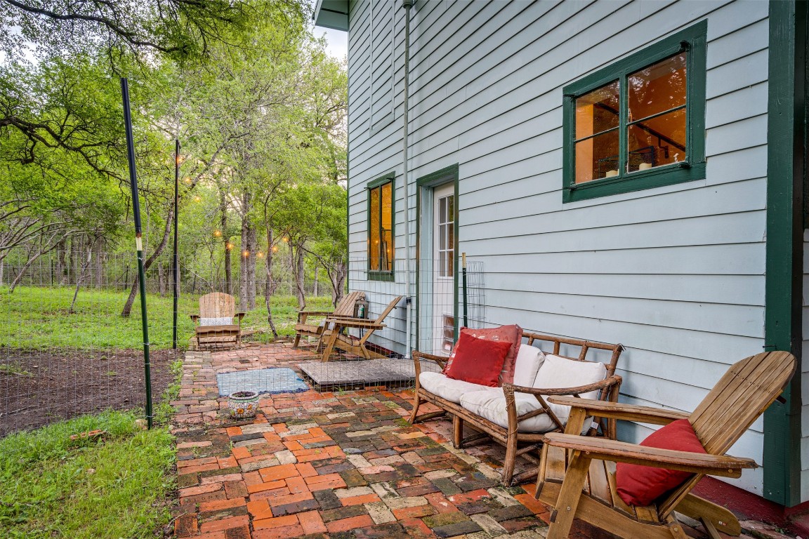 112 Boulder Lane Manor, TX 78653 - Photo 28 of 39 a backyard of a house with outdoor seating