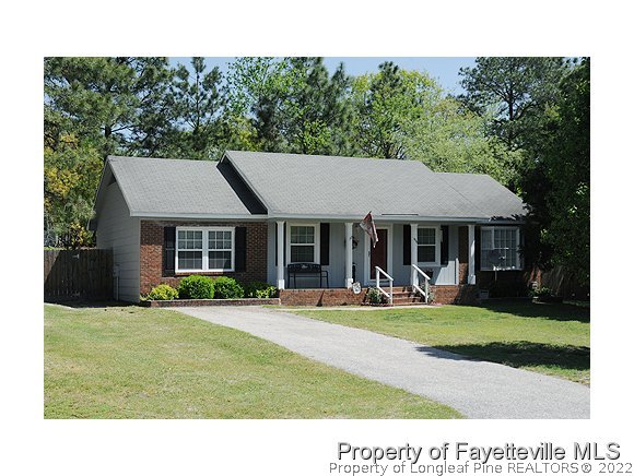 638 Azalea Drive Spring Lake, NC 28390 - Photo 1 of 14 a house view with a sitting space and garden
