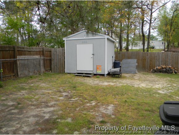 638 Azalea Drive Spring Lake, NC 28390 - Photo 11 of 14 a view of backyard with small cabin