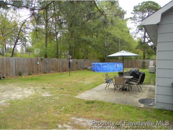 638 Azalea Drive Spring Lake, NC 28390 - Photo 12 of 14 a view of a backyard with sitting area and furniture