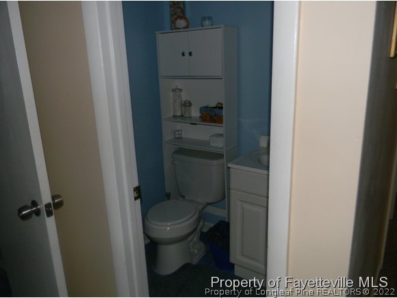 638 Azalea Drive Spring Lake, NC 28390 - Photo 7 of 14 a bathroom with a toilet and a sink