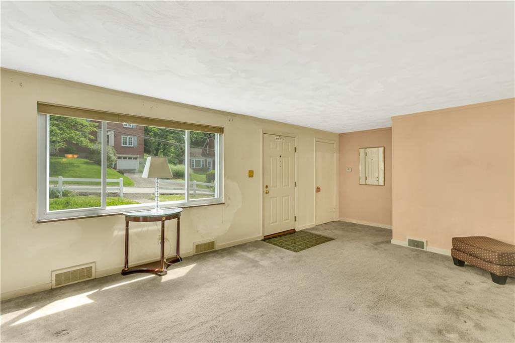 122 Spring Grove Road Pittsburgh, PA 15235 - Photo 7 of 25 The coat closet in the living room is a walk-in closet.