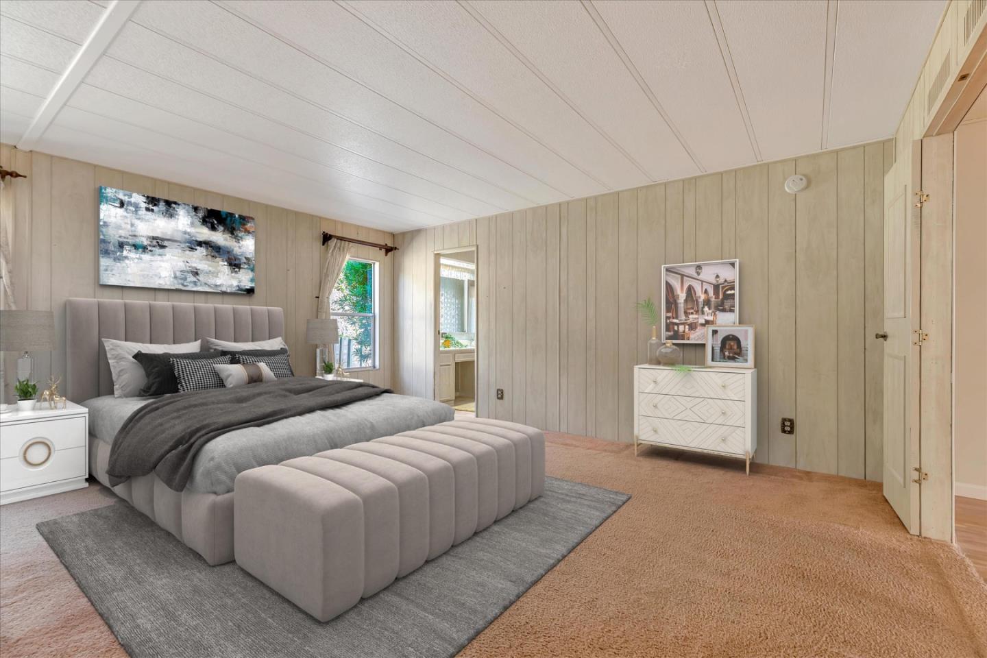 270 Hames Road, Unit 50 Corralitos, CA 95076 - Photo 13 of 31 a bedroom with a bed and a painting on the wall