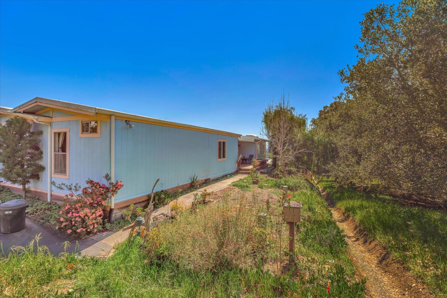 270 Hames Road, Unit 50 Corralitos, CA 95076 - Photo 18 of 31 a front view of a house with a yard