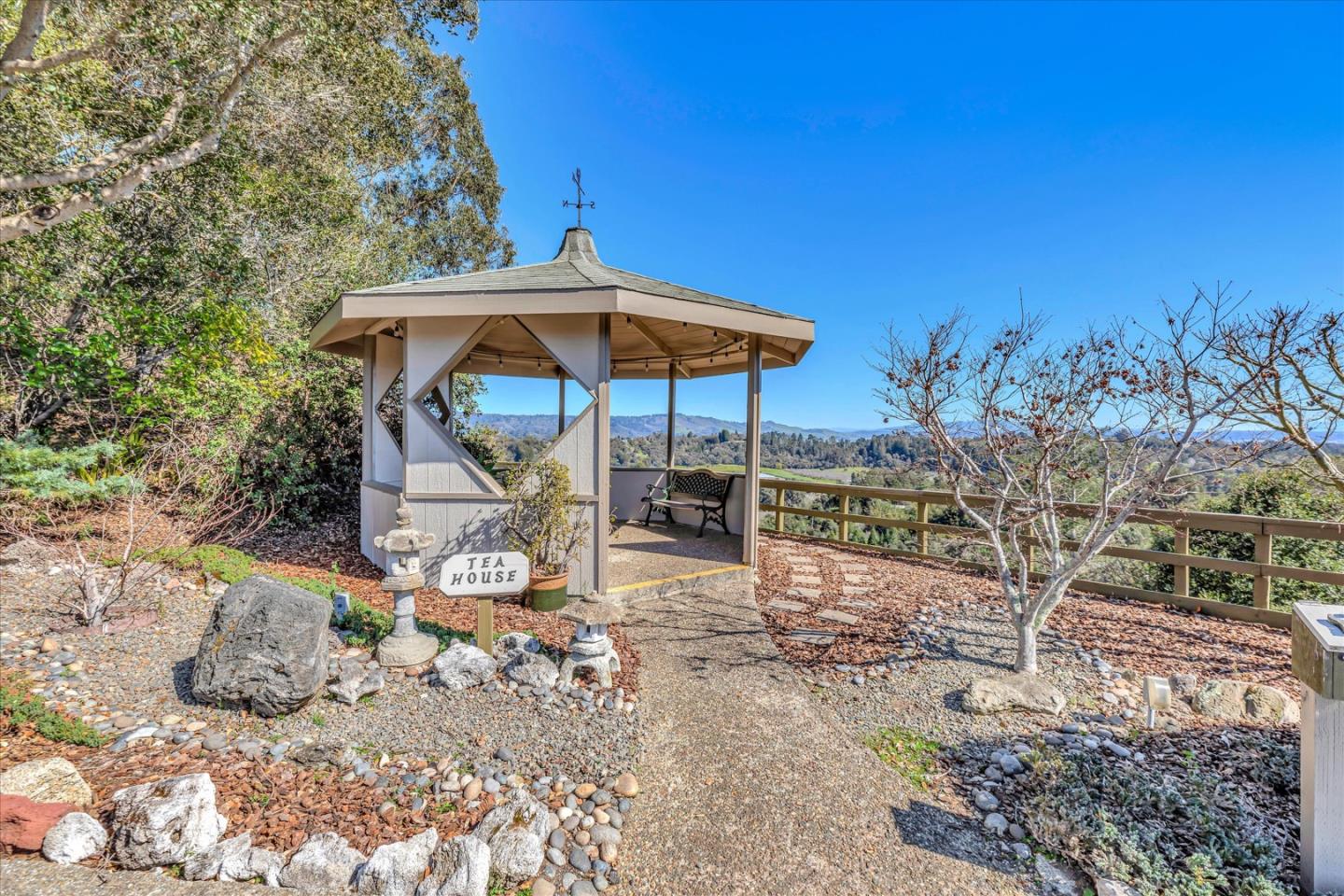 270 Hames Road, Unit 50 Corralitos, CA 95076 - Photo 21 of 31 a view of a table and chairs under an umbrella
