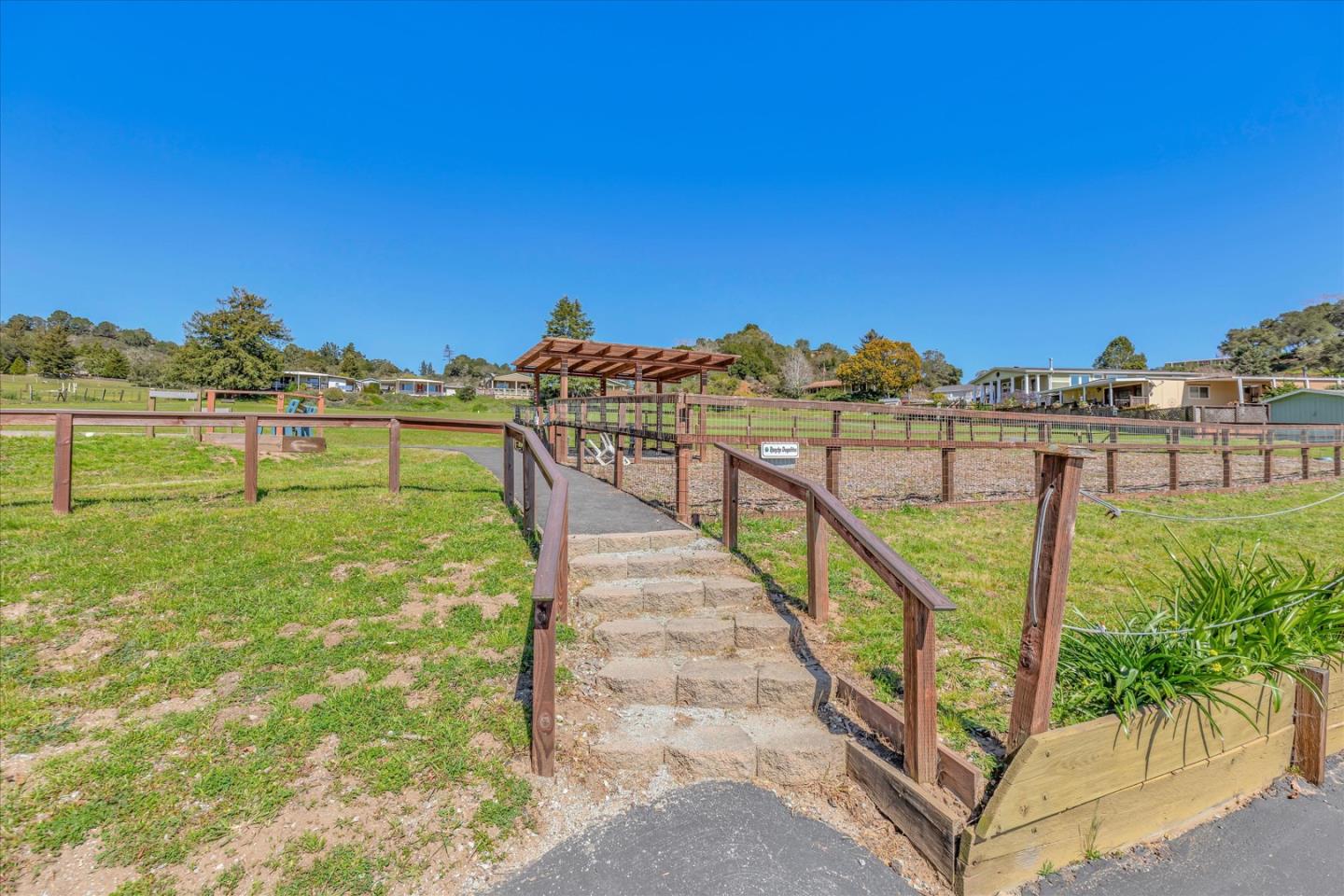 270 Hames Road, Unit 50 Corralitos, CA 95076 - Photo 26 of 31 a view of a swimming pool with a yard and mountain view