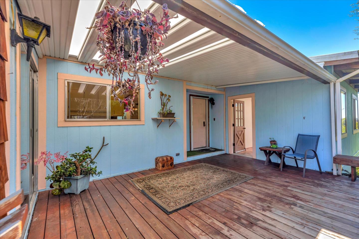 270 Hames Road, Unit 50 Corralitos, CA 95076 - Photo 3 of 31 a hallway with wooden floor and a potted plant