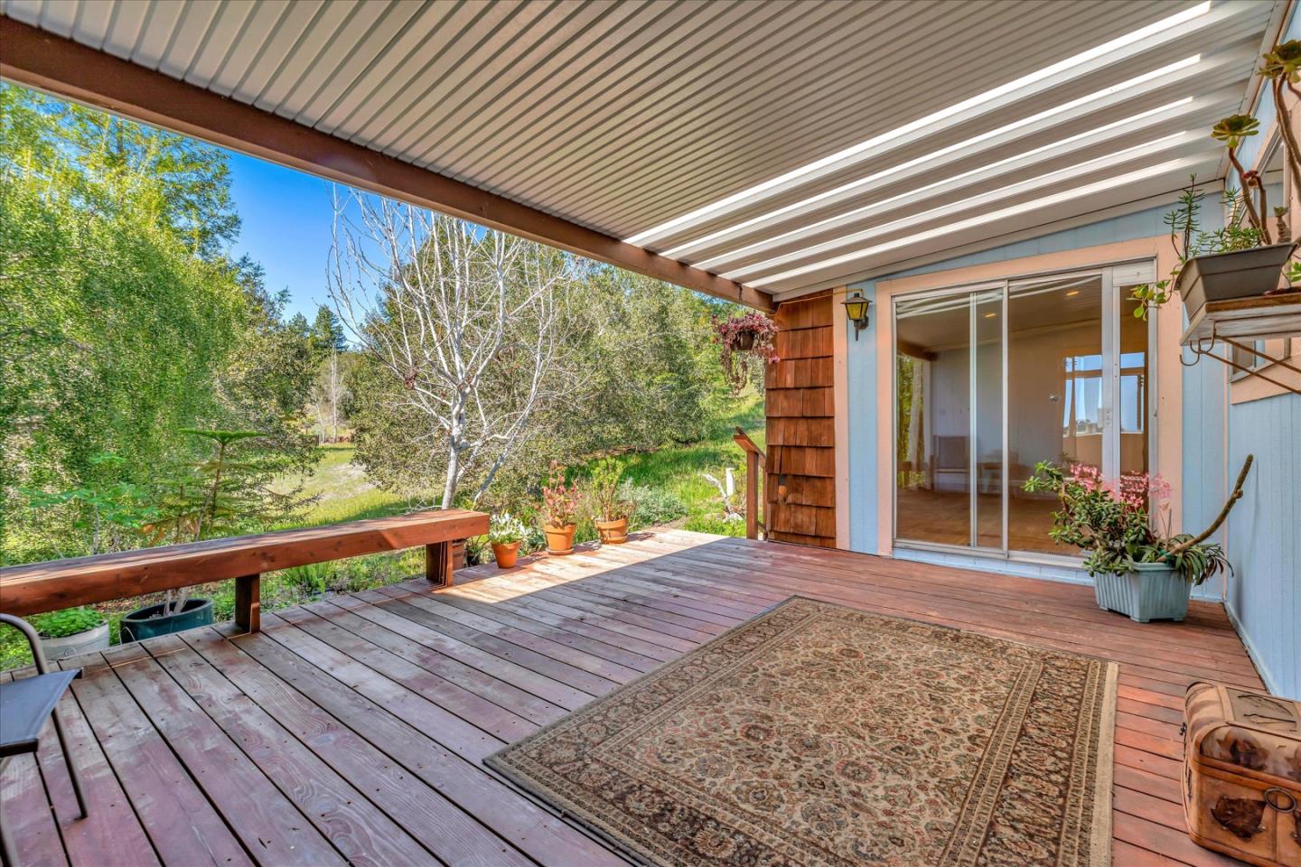 270 Hames Road, Unit 50 Corralitos, CA 95076 - Photo 5 of 31 a view of a roof deck with wooden floor and fence next to a yard