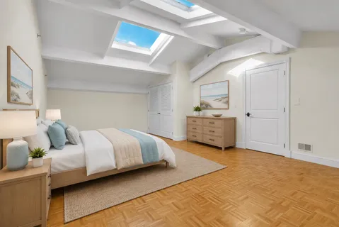 a bedroom with a bed and a cabinets