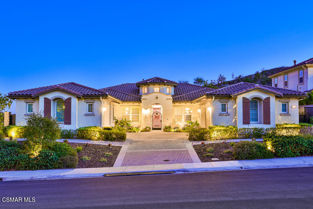 a front view of building with yard