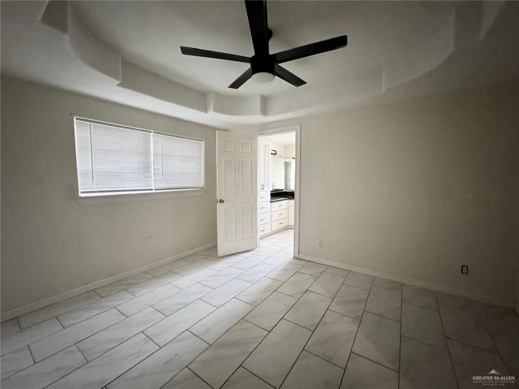 2709 Austin Avenue McAllen, TX 78501 - Photo 9 of 12 a view of an empty room and window chandelier fan