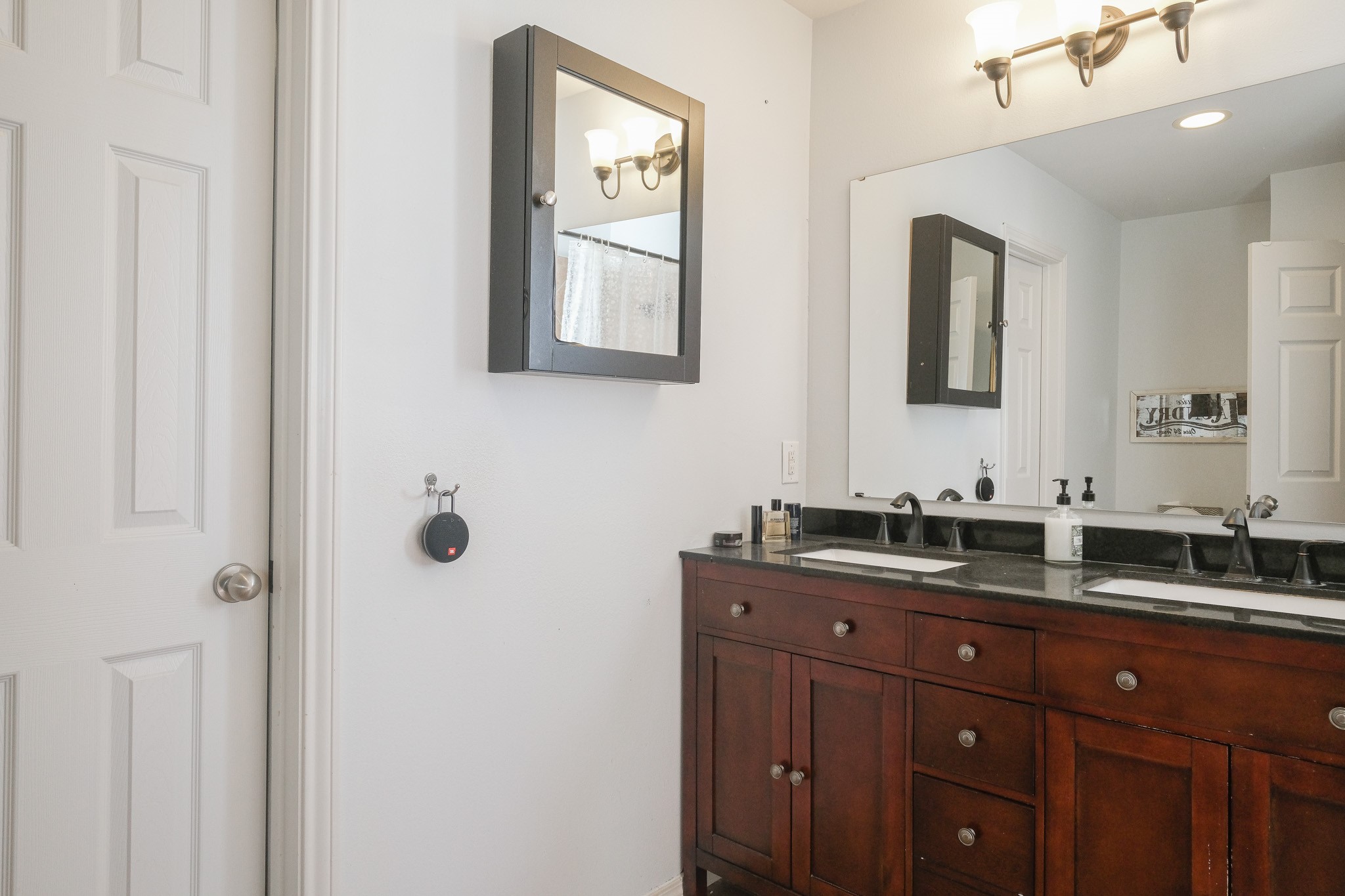 2609 Link Road Houston, TX 77009 - Photo 14 of 21 a bathroom with double vanity two mirror and a window