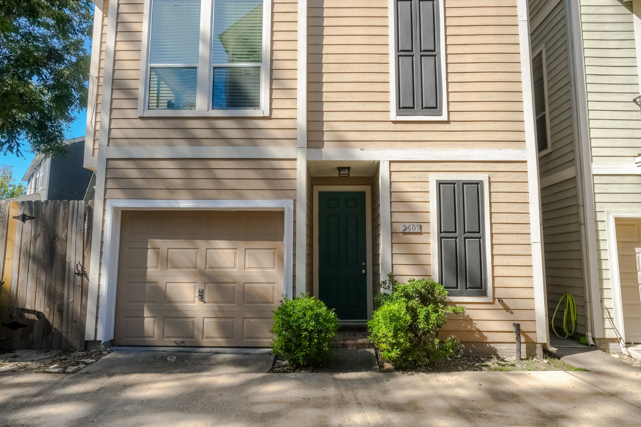 2609 Link Road Houston, TX 77009 - Photo 2 of 21 a front view of a house with a yard