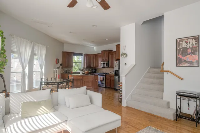 a dining room with furniture and wooden floor