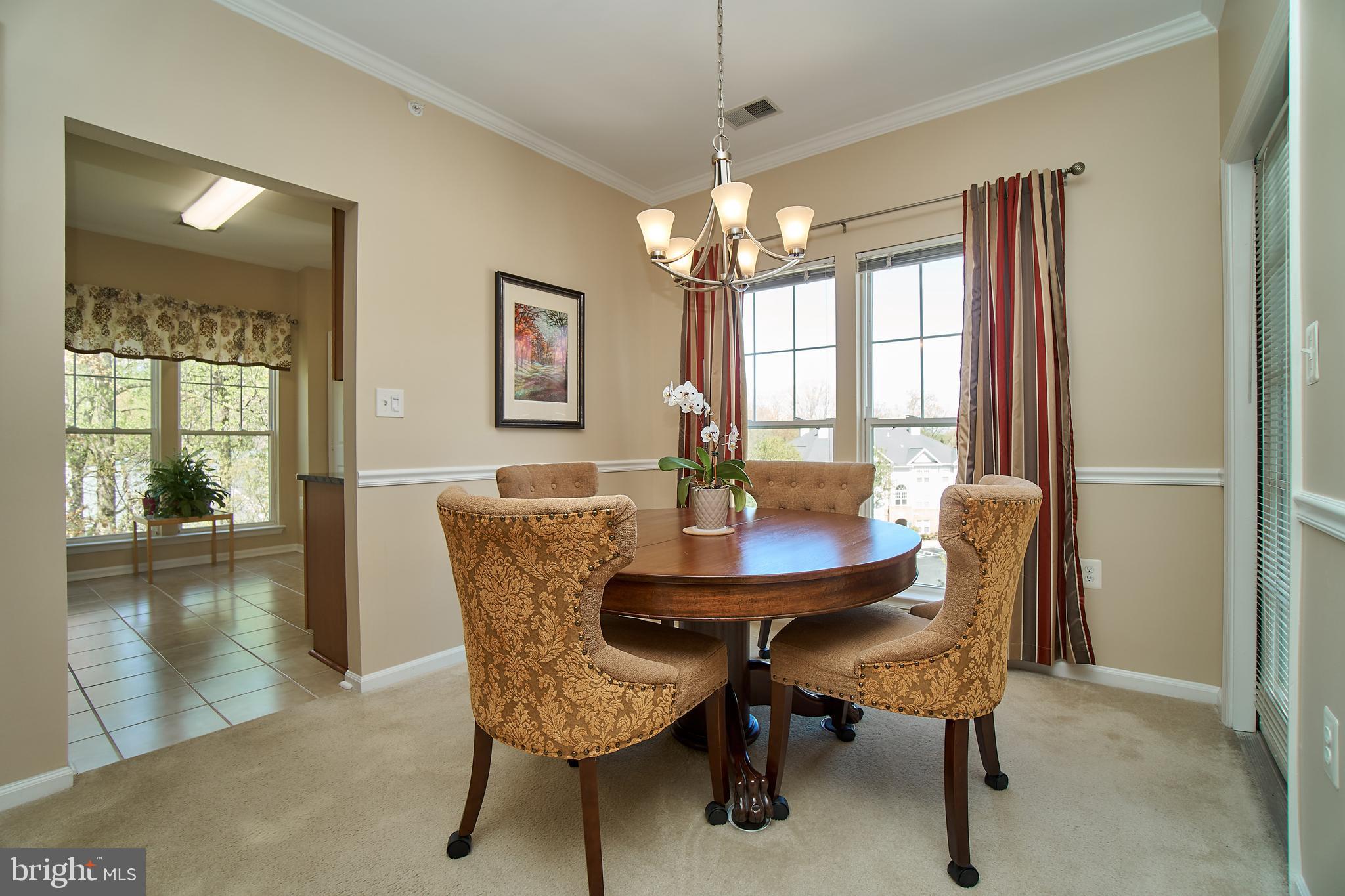 1520 North Point Drive, Unit 303 Reston, VA 20194 - Photo 12 of 29 Dining space with big windows.