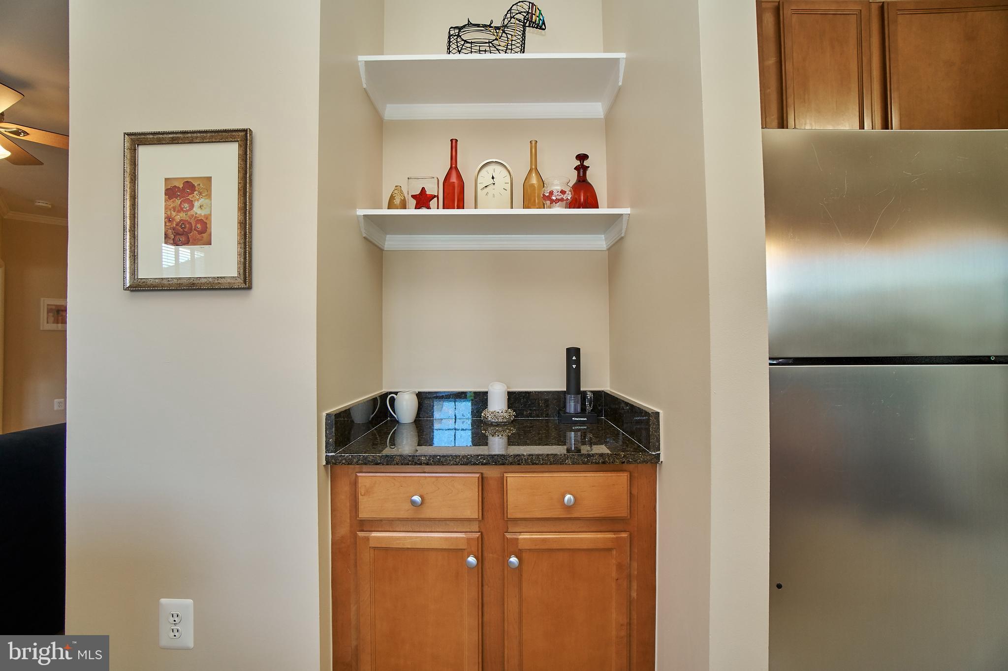 1520 North Point Drive, Unit 303 Reston, VA 20194 - Photo 14 of 29 Dry bar in dining space. Party time.