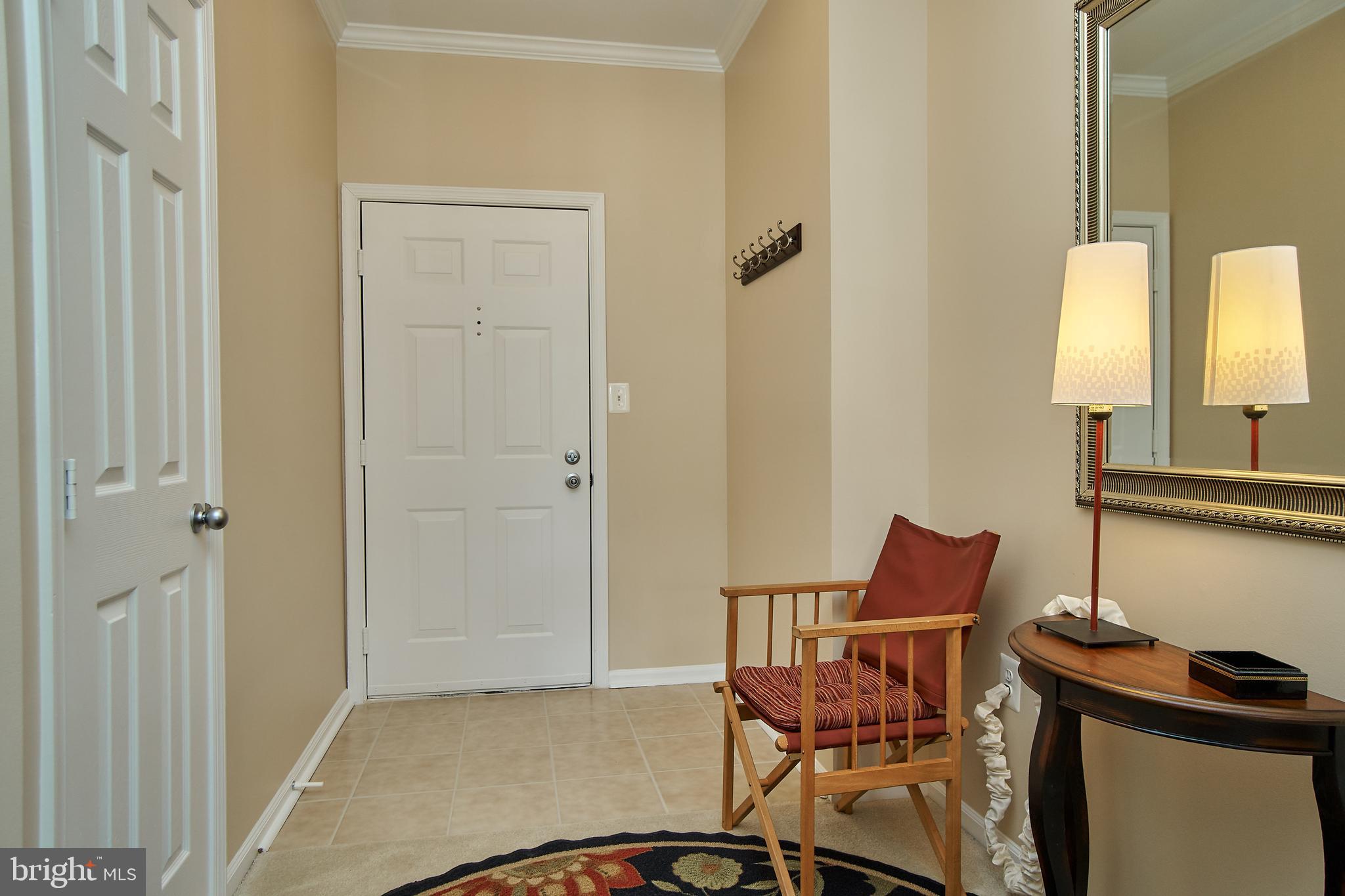 1520 North Point Drive, Unit 303 Reston, VA 20194 - Photo 3 of 29 Large foyer with coat closet. Drop your keys.