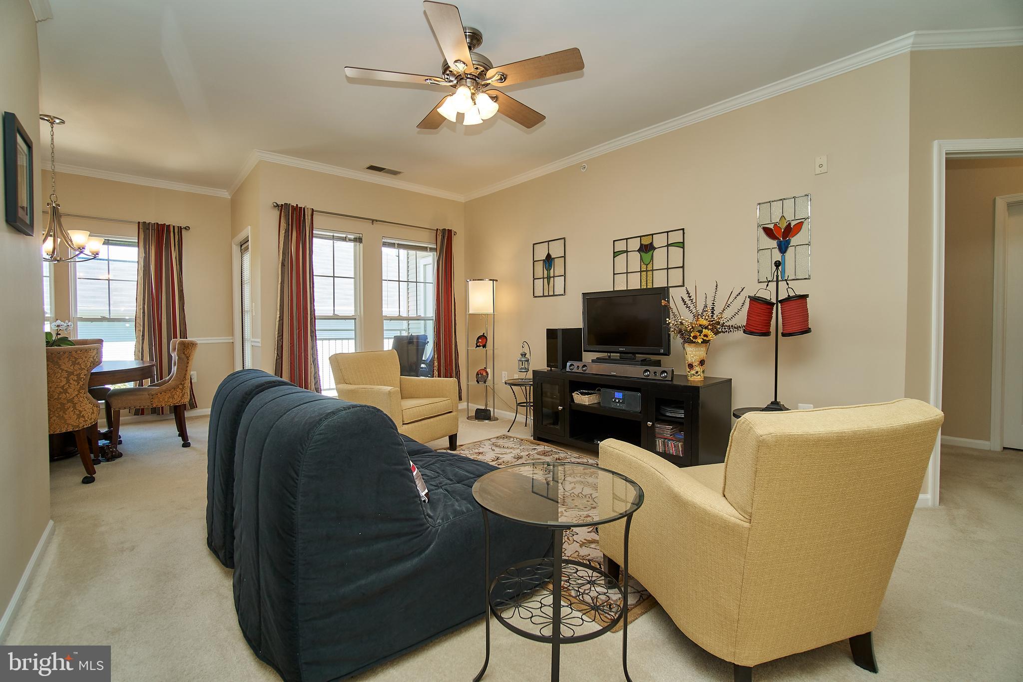 1520 North Point Drive, Unit 303 Reston, VA 20194 - Photo 5 of 29 Room for large TV and plenty of seating.