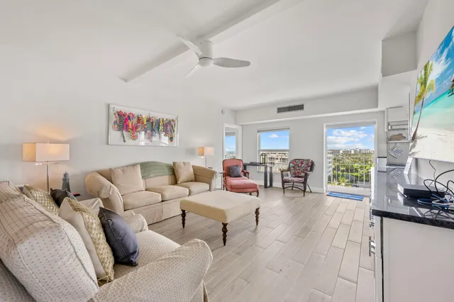 a view of a livingroom with furniture and a window
