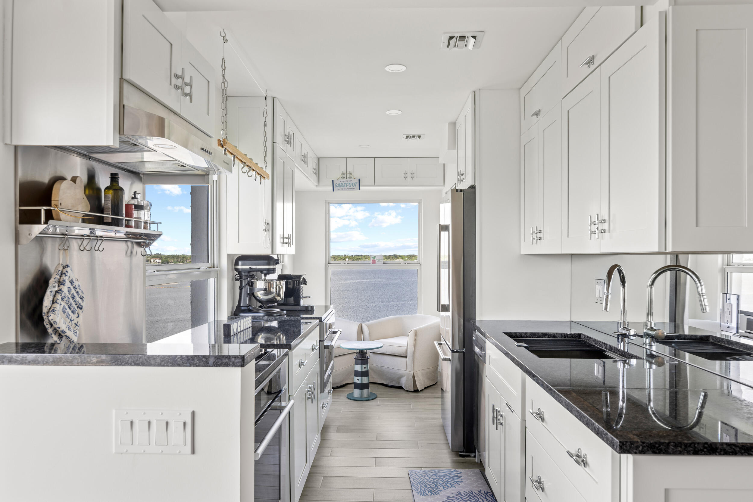 3230 South Ocean Boulevard, Unit A602 Palm Beach, FL 33480 - Photo 17 of 87 a kitchen with stainless steel appliances granite countertop a sink stove and refrigerator