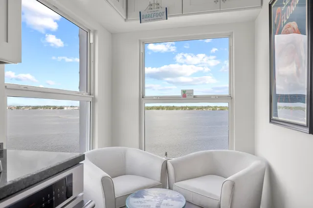 a view of a workspace with furniture and stairs