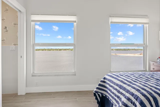 a view of bathroom with washing machine and mirror