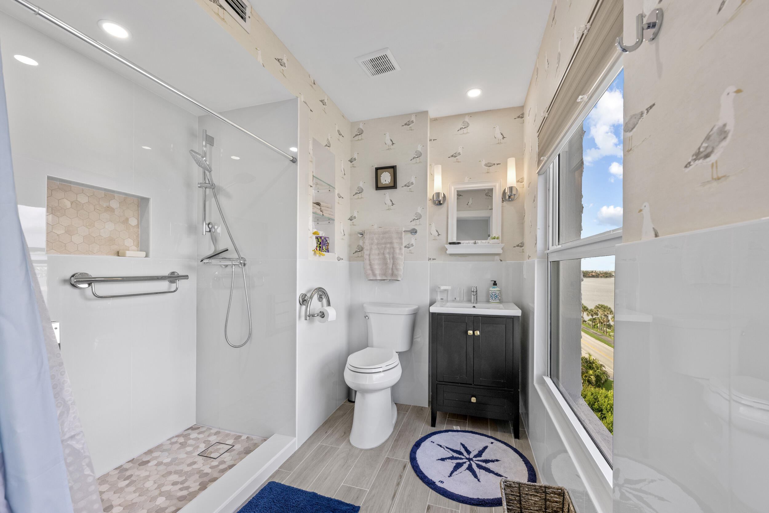 3230 South Ocean Boulevard, Unit A602 Palm Beach, FL 33480 - Photo 31 of 87 a bathroom with a granite countertop sink a toilet and shower