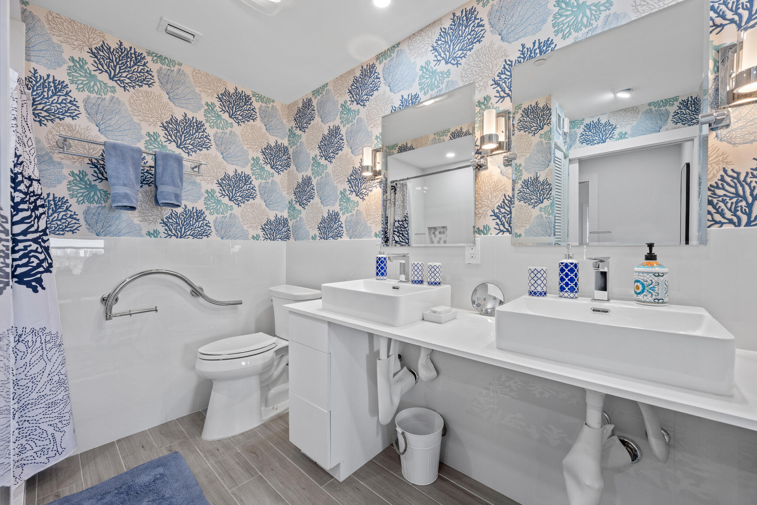 3230 South Ocean Boulevard, Unit A602 Palm Beach, FL 33480 - Photo 35 of 87 a bathroom with a sink toilet and a mirror