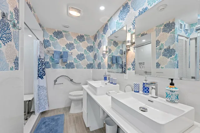 a view of a building with a swimming pool and sitting area