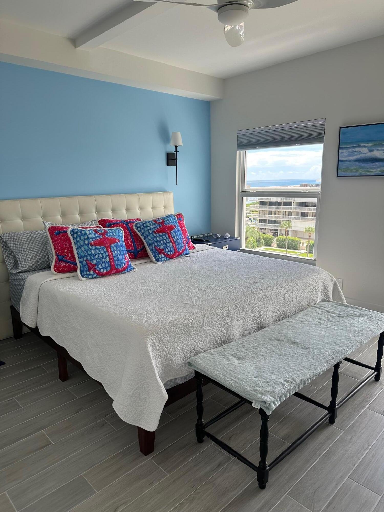 3230 South Ocean Boulevard, Unit A602 Palm Beach, FL 33480 - Photo 40 of 87 a bedroom with a bed and wooden floor