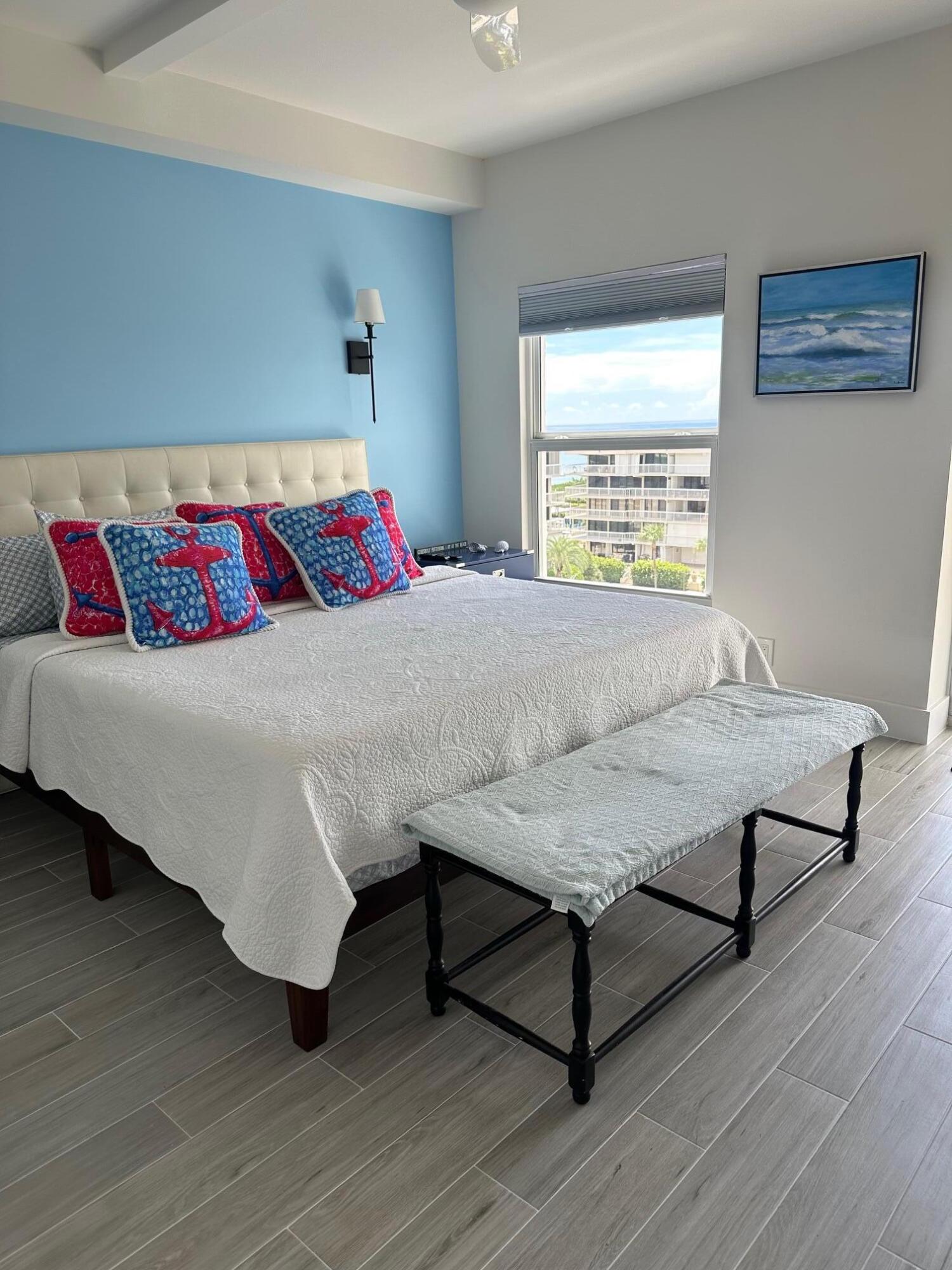 3230 South Ocean Boulevard, Unit A602 Palm Beach, FL 33480 - Photo 41 of 87 a living room with a bed and a night stand