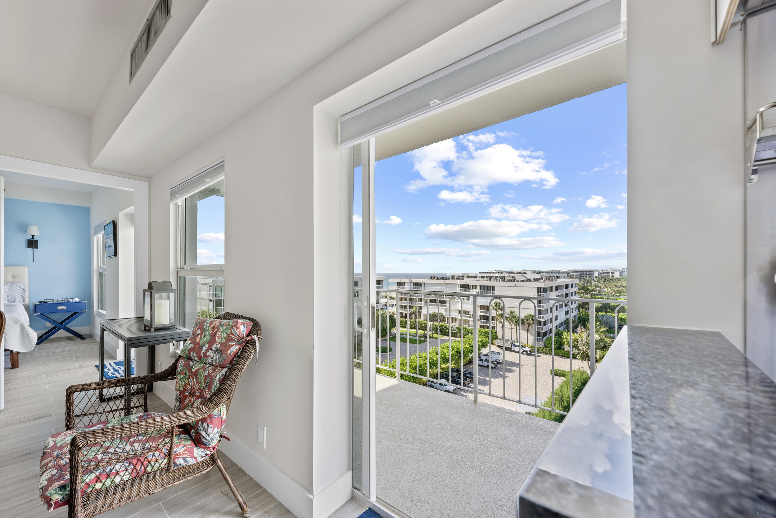 3230 South Ocean Boulevard, Unit A602 Palm Beach, FL 33480 - Photo 46 of 87 a living room with furniture and a floor to ceiling window