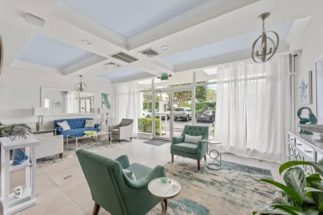 a view of a swimming pool with a yard and seating area