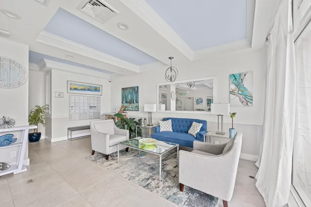 a aerial view of a house with a swimming pool and outdoor seating