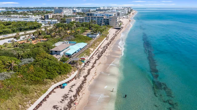 a view of a living room with a floor to ceiling window